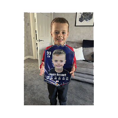 Kid holding Sports Billy personalised FUT Card